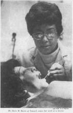 Black and white image of Doris Marshall practicing dentistry.